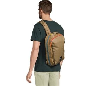 Cotopaxi Tan Backpack with Red and Blue Accents